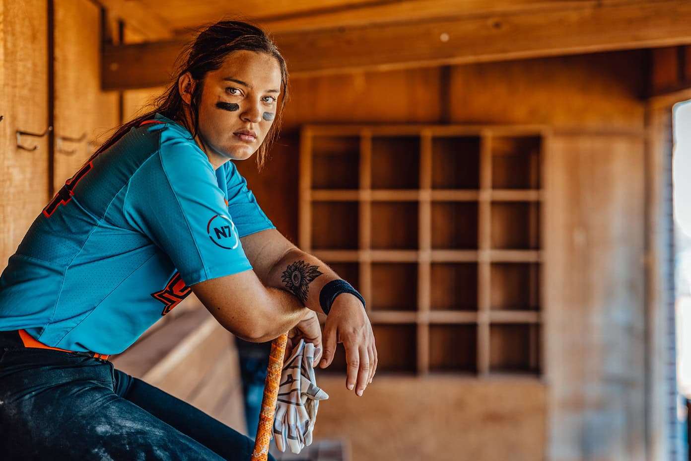 Michaela Richbourg rests her arms on her bat