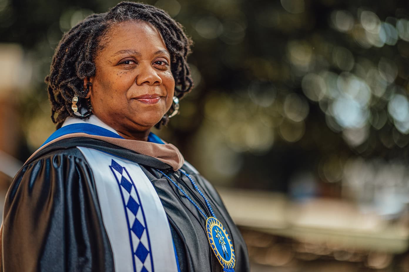 Shanna Douglas smiles in her graduation robes