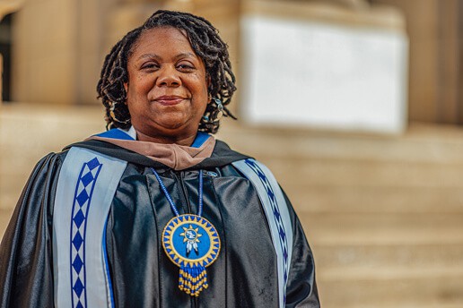 Shanna Douglas smiles in her graduation robes