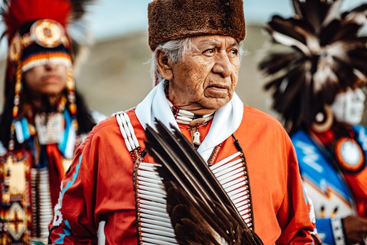 Wilson Roberts and two others pose in traditional dress