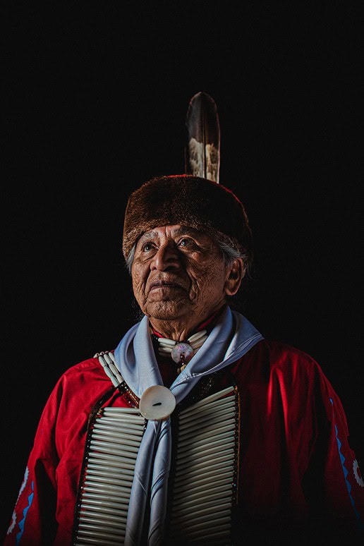 Wilson Roberts looks up in his traditional Choctaw clothing