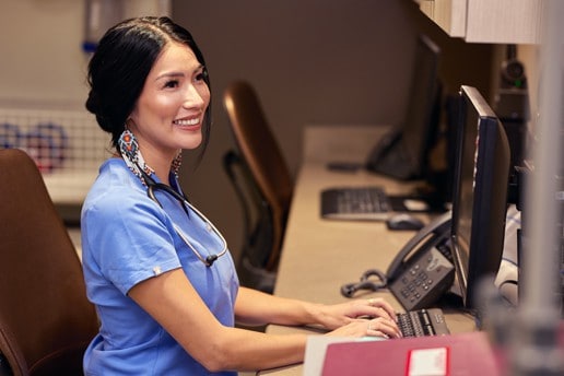 Tara Thorpe working at a desk