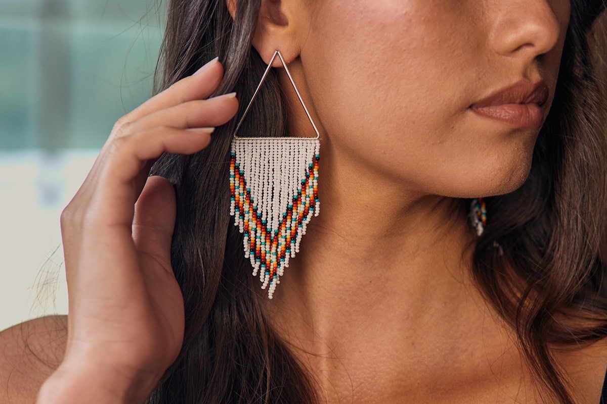 Jula Harjo models one of her beaded earrings