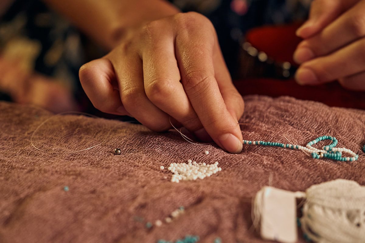 a closeup of Jula Harjo's beaded jewelry strands