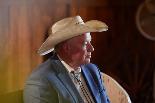 Mike Mings sitting in a pew