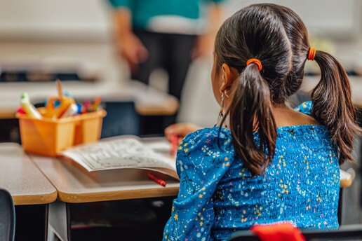 the back of a child's head in Stephanie Robert's classroom