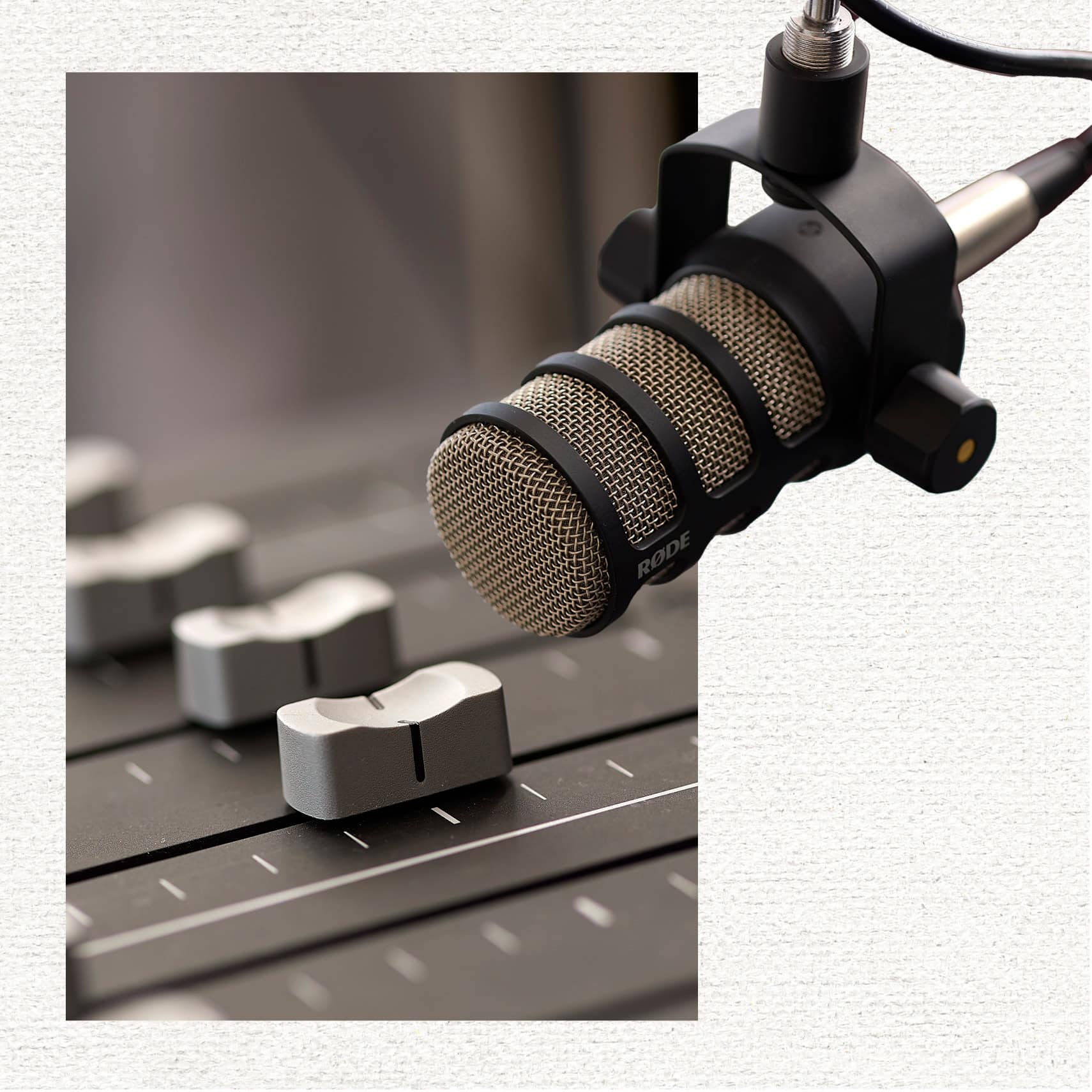 A Røde microphone is overlaid on a set of audio faders