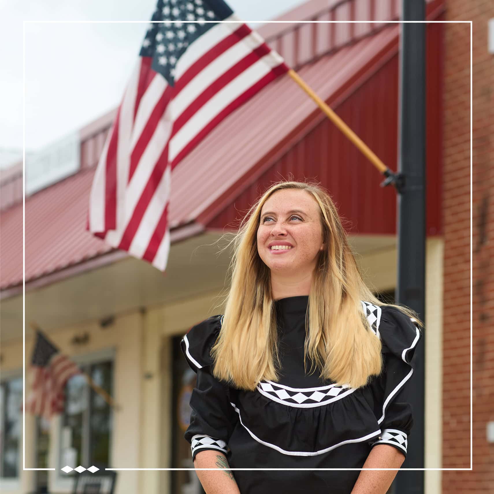 Celebrating community and cultural diversity in McCurtain County with a smiling woman in traditional dress.