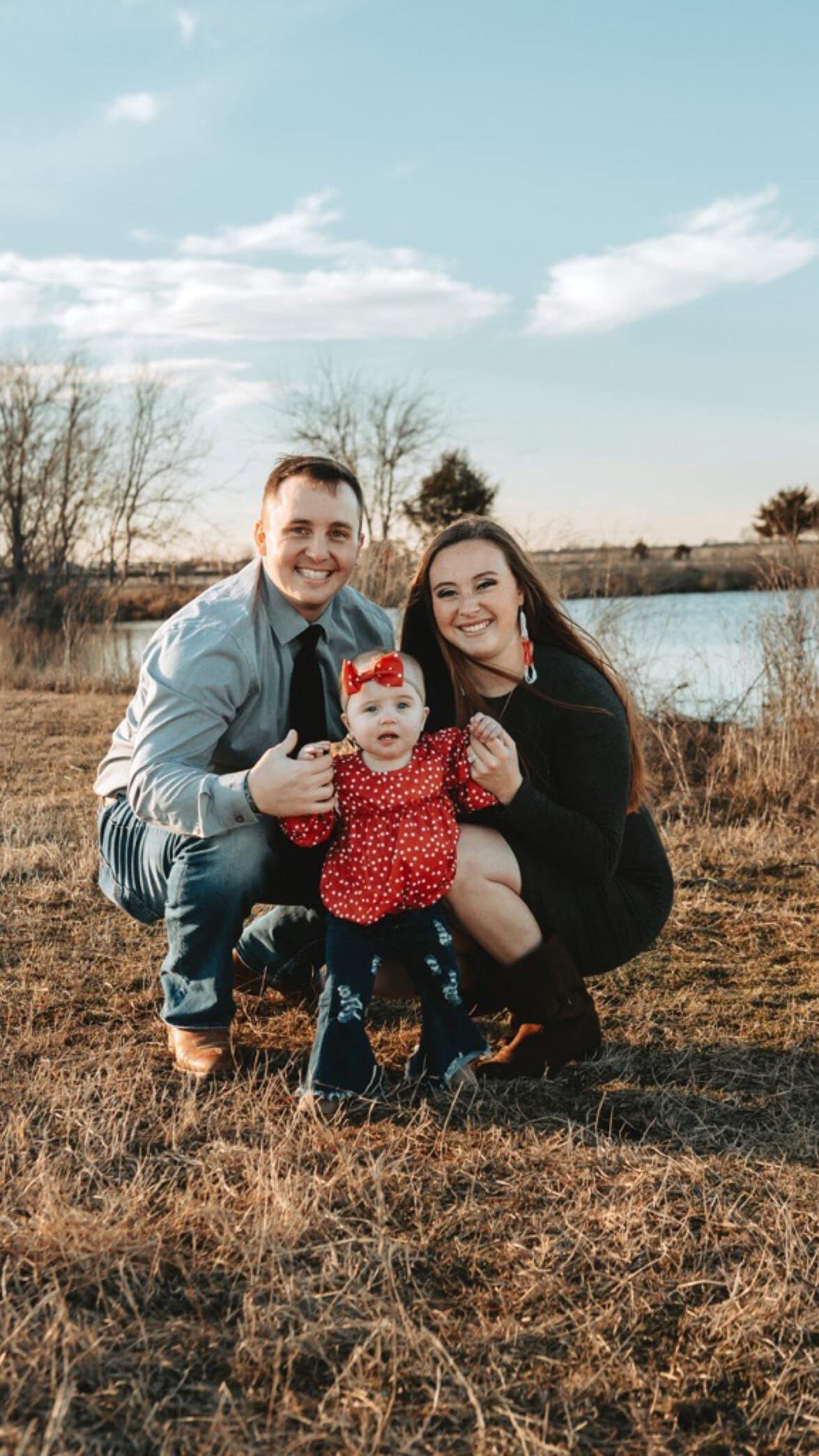 Happy family outdoors during sunset, emphasizing unity and love.