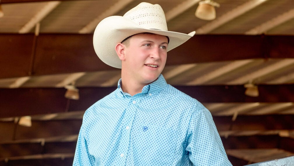 Hazen wearing a blue shirt while staring to his left.