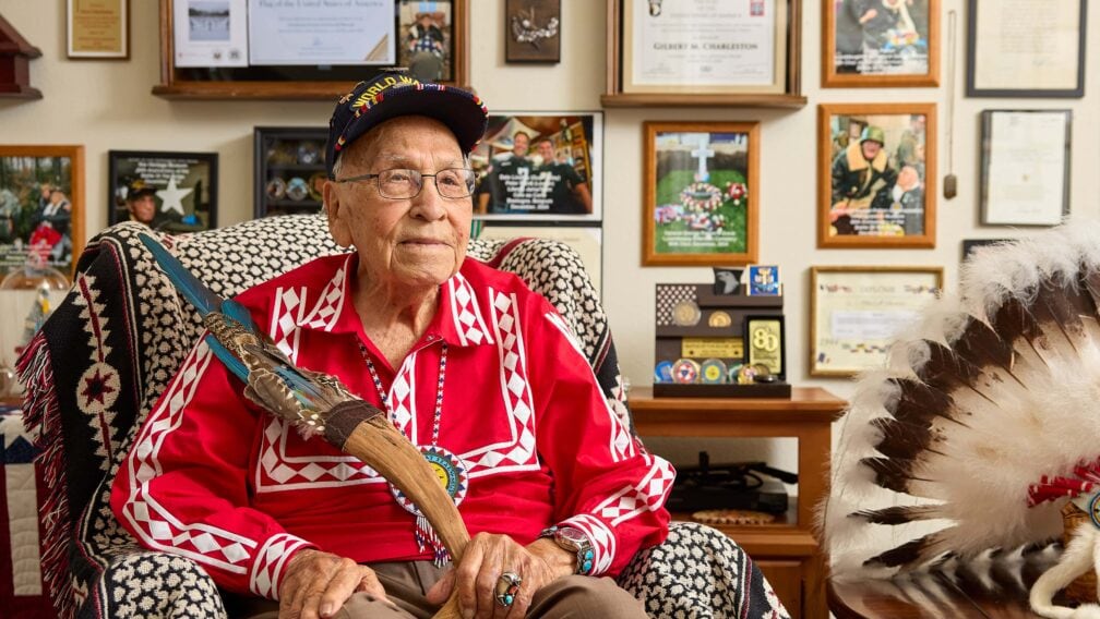 Photo of Choc with all the images of his past with him in the background along with his medallions