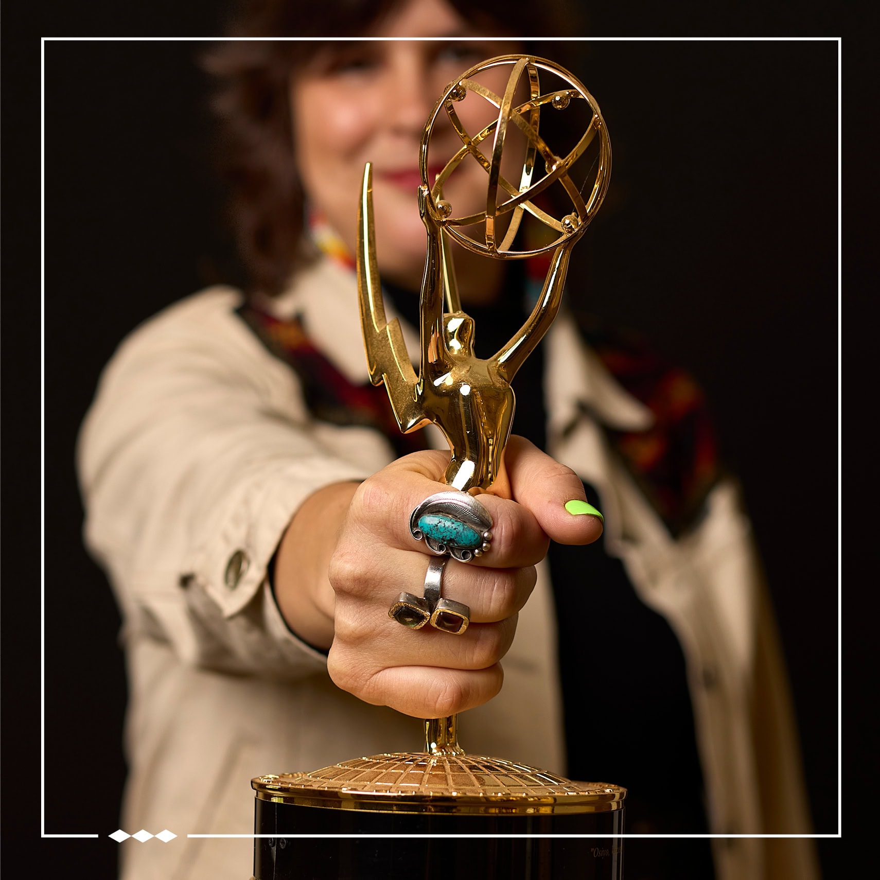 Colleen Thurston holding one of her awards.